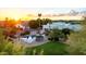 Stunning backyard at sunset features a pool, lush landscaping, and privacy fencing at 9035 W Villa Chula --, Peoria, AZ 85383