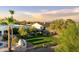 Spacious backyard with green lawn, desert landscaping, and view of the mountains at 9035 W Villa Chula --, Peoria, AZ 85383