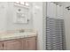Bright bathroom featuring a neutral tile countertop and a shower with a black and white shower curtain at 9035 W Villa Chula --, Peoria, AZ 85383