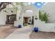 Inviting front entrance with desert landscaping, archway, and potted plants at 9035 W Villa Chula --, Peoria, AZ 85383