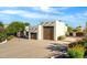 Southwestern home featuring stucco siding, a three car garage, mature landscaping, and a concrete driveway at 9035 W Villa Chula --, Peoria, AZ 85383