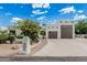 Charming home with a two-car garage, inviting curb appeal, and a well-maintained front yard at 9035 W Villa Chula --, Peoria, AZ 85383