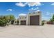 Stylish house with an attached garage and a well-maintained driveway under a sunny sky at 9035 W Villa Chula --, Peoria, AZ 85383