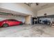 Spacious garage with epoxy floors, overhead lighting, and built-in storage cabinets at 9035 W Villa Chula --, Peoria, AZ 85383