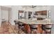 Kitchen island with granite counters, seating, stainless steel appliances, and wooden cabinets at 9035 W Villa Chula --, Peoria, AZ 85383