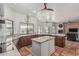 Bright and spacious kitchen featuring custom cabinets, stainless steel appliances, and tile flooring at 9035 W Villa Chula --, Peoria, AZ 85383