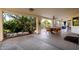 Covered patio with an outdoor dining set overlooking the landscaped backyard at 9035 W Villa Chula --, Peoria, AZ 85383
