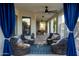 Relaxing covered patio area with comfortable seating and stylish blue accents at 9035 W Villa Chula --, Peoria, AZ 85383