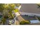 Expansive aerial view of the property showcasing the lush landscaping, backyard pool, and stylish outdoor lounging areas at 9517 E Minton St, Mesa, AZ 85207