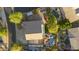 Overhead aerial view of a residence showcasing backyard pools, patios, and lush landscaping in a well-maintained neighborhood at 9517 E Minton St, Mesa, AZ 85207