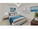 Comfortable bedroom with light grey carpet, modern furniture, white shutters, and bright lamps at 9517 E Minton St, Mesa, AZ 85207