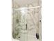 New, modern shower with marble tile and a sliding glass door at 9517 E Minton St, Mesa, AZ 85207