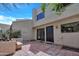 Private back patio area featuring beautiful tiling, lush vegetation and a large view window at 9807 N 5Th St, Phoenix, AZ 85020