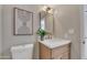 Stylish bathroom with a modern vanity, white countertop, and decorative art at 9807 N 5Th St, Phoenix, AZ 85020