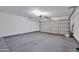 Empty garage with gray floors and white walls at 9807 N 5Th St, Phoenix, AZ 85020