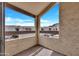 Outdoor patio with wood beam construction, textured walls, and neighborhood views at 9807 N 5Th St, Phoenix, AZ 85020