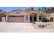 Charming single-story home featuring a terracotta tile roof, stucco exterior, and well-maintained desert landscaping at 10952 S Desert Lake Dr, Goodyear, AZ 85338