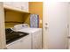 Laundry room featuring white washer and dryer with white cabinets above at 10952 S Desert Lake Dr, Goodyear, AZ 85338