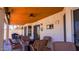 Outdoor covered patio area with outdoor furniture including a fire pit at 10952 S Desert Lake Dr, Goodyear, AZ 85338