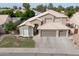 An aerial view of a lovely two-story home with manicured lawn, three-car garage and tile roof at 1132 E Sheffield Ave, Chandler, AZ 85225