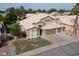 An aerial view of a well-kept two-story home with manicured lawn, three-car garage and landscaped yard at 1132 E Sheffield Ave, Chandler, AZ 85225