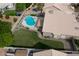 Aerial view of backyard featuring pool, lush lawn, and well-maintained landscaping at 1132 E Sheffield Ave, Chandler, AZ 85225