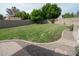 A well-maintained, large backyard with a green lawn and a brick-lined border offering plenty of space at 1132 E Sheffield Ave, Chandler, AZ 85225