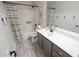 Bathroom with sink, vanity, toilet, bath tub and shower with hooks on the wall and decor at 1132 E Sheffield Ave, Chandler, AZ 85225