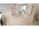 Bright bathroom with dual vanities, soaking tub and walk-in shower featuring updated fixtures and tile at 1132 E Sheffield Ave, Chandler, AZ 85225