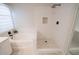 Bright bathroom featuring soaking tub and walk-in shower with contemporary fixtures and decorative stone detail at 1132 E Sheffield Ave, Chandler, AZ 85225