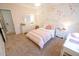 Adorable bedroom with white furniture, pink decorations and floral wallpaper, plus plenty of light at 1132 E Sheffield Ave, Chandler, AZ 85225