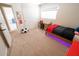 Well-lit bedroom features carpet, desk and chair, and ample storage space at 1132 E Sheffield Ave, Chandler, AZ 85225