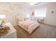 Bright bedroom features charming floral wallpaper, comfortable bed, and a dedicated desk area at 1132 E Sheffield Ave, Chandler, AZ 85225