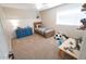 Cozy bedroom features natural light, a wooden bed, and a playful soccer ball accent at 1132 E Sheffield Ave, Chandler, AZ 85225