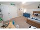 Comfortable bedroom with a blue dresser, a decorative sign and carpet flooring at 1132 E Sheffield Ave, Chandler, AZ 85225
