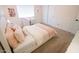 Cozy bedroom featuring a comfortable bed with decorative pillows, a desk, and ample natural light at 1132 E Sheffield Ave, Chandler, AZ 85225