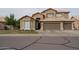 Charming two-story home featuring a three-car garage, neutral stucco and well-maintained landscaping at 1132 E Sheffield Ave, Chandler, AZ 85225