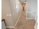 Upstairs hallway with carpet and framed artwork on the wall and access to bedrooms and a bonus room at 1132 E Sheffield Ave, Chandler, AZ 85225