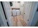 Well organized laundry room with side by side washer and dryer, folding table, shelving, and storage at 1132 E Sheffield Ave, Chandler, AZ 85225