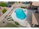 Aerial view of a backyard pool featuring a connected hot tub, seating and landscaping at 1132 E Sheffield Ave, Chandler, AZ 85225