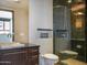 Modern bathroom with a glass shower, vanity with marble countertop, and a vessel sink at 114 W Adams St # Ph, Phoenix, AZ 85003