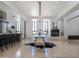 Spacious dining room with modern table, sleek chairs, and a minimalist fireplace in an open-concept design at 114 W Adams St # Ph, Phoenix, AZ 85003