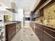 Modern kitchen with stainless steel appliances, granite countertops, and sleek cabinetry for a gourmet cooking experience at 114 W Adams St # Ph, Phoenix, AZ 85003