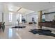 Open-concept living area with sleek dining set, cozy fireplace, and seamless flow for modern living at 114 W Adams St # Ph, Phoenix, AZ 85003