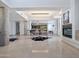 Open-concept living area with sleek dining set, cozy fireplace, and seamless flow for modern living at 114 W Adams St # Ph, Phoenix, AZ 85003