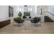 Stylish living room featuring chic seating, modern art, and a bright, airy atmosphere with ample natural light at 114 W Adams St # Ph, Phoenix, AZ 85003