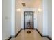 Building lobby featuring a marble floor with accent inlay and elevator access at 114 W Adams St # Ph, Phoenix, AZ 85003