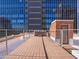 Spacious rooftop deck with a hot tub and city skyline views at 114 W Adams St # Ph, Phoenix, AZ 85003