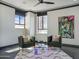 Bright sitting area with comfortable chairs, stylish decor, and city views through large windows at 114 W Adams St # Ph, Phoenix, AZ 85003