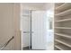 Open walk-in closet leading to spacious bathroom at 1227 E Sheena Dr, Phoenix, AZ 85022
